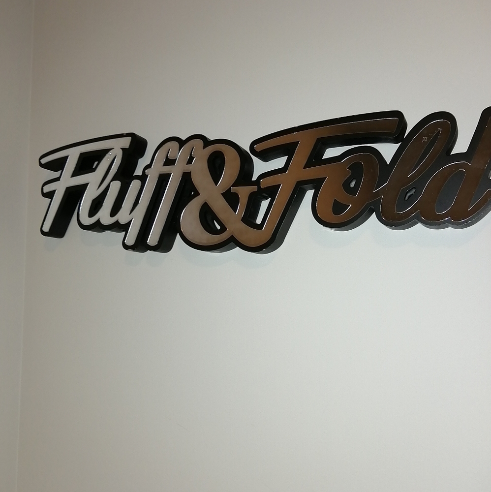 Vintage hanging Fluff & Fold laundry sign